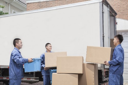Professional movers loading items into a truck