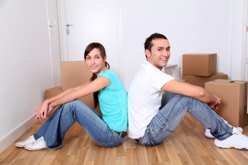 Satisfied customers receiving assistance from house removalists